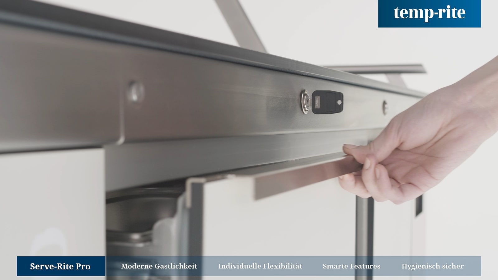 Hand operation of a product drawer in a reduced set.