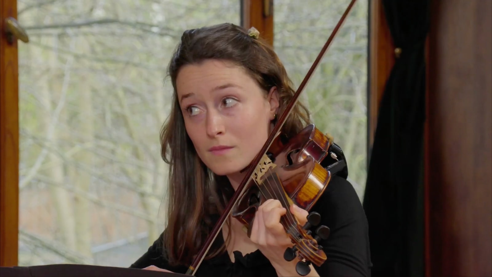 Violinist in the music and performance sessions.
