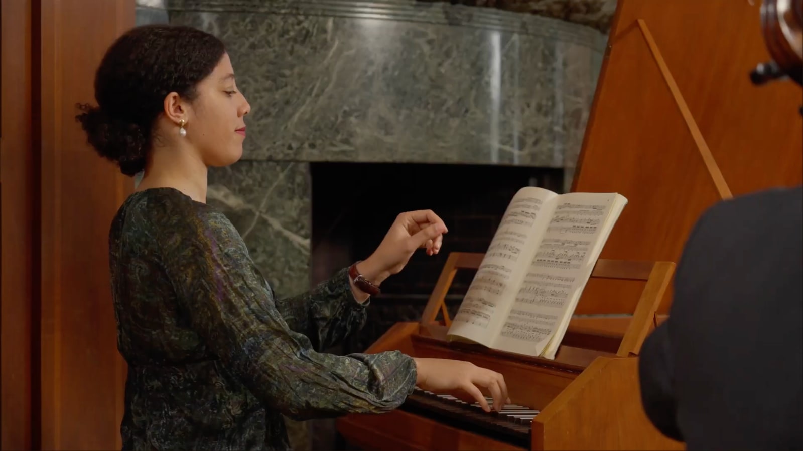 Pianist at a music stand during the music and performance sessions.