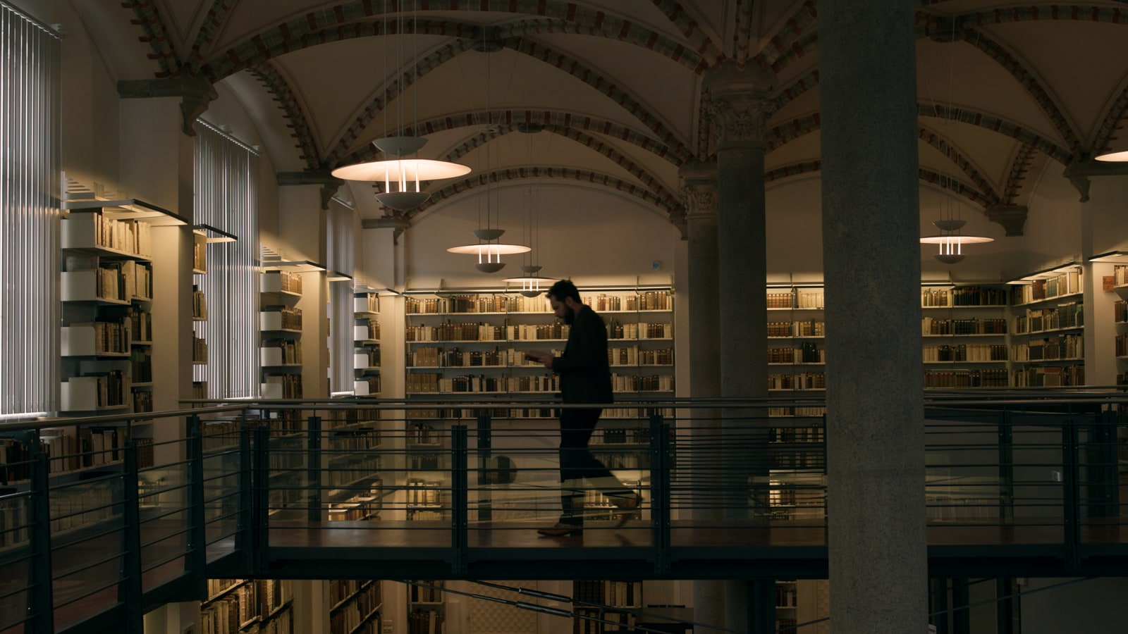Wide library still from the DaVinci Spec Spot with controlled commercial lighting.