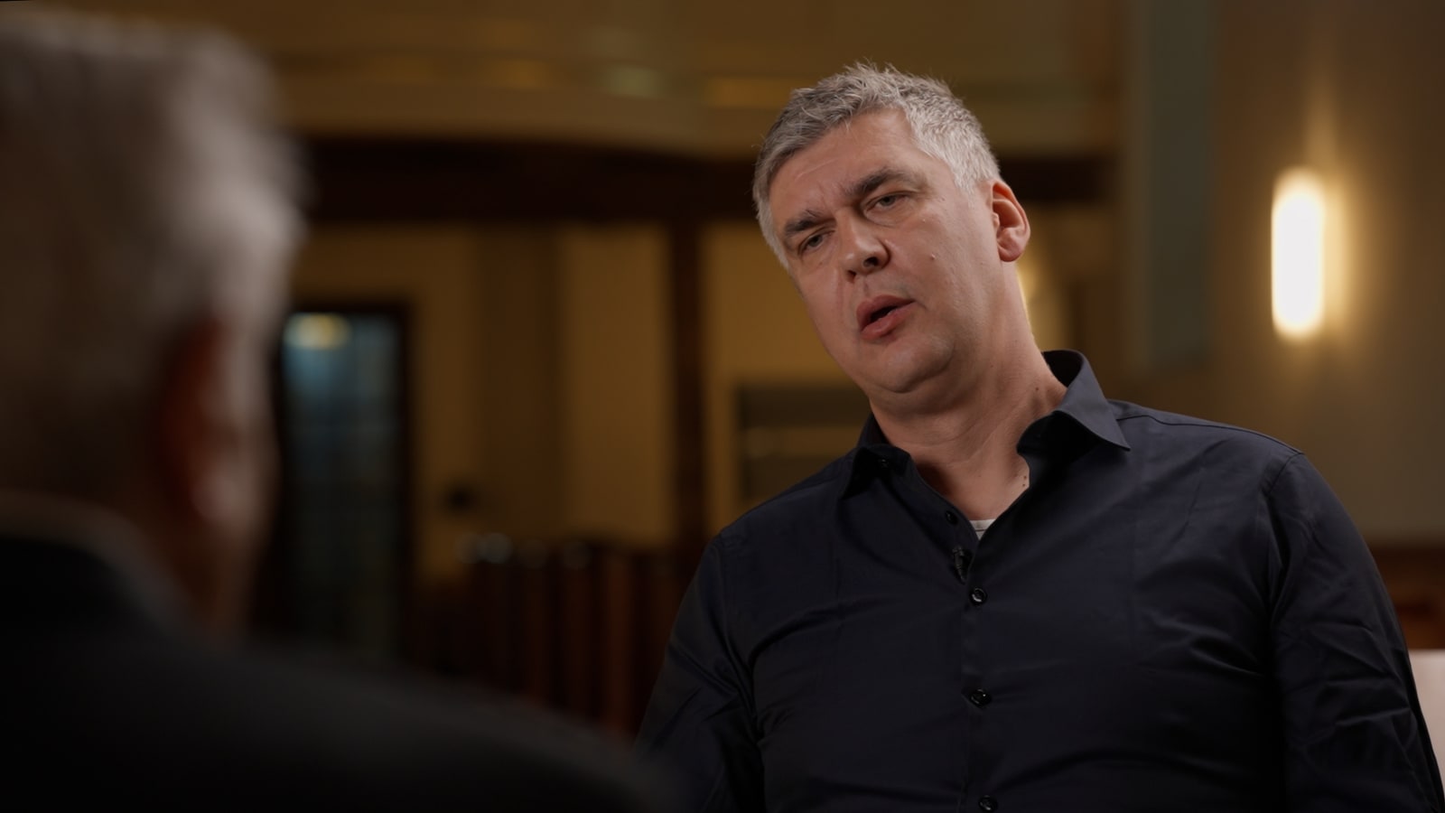 Conversation moment during the documentary interview.