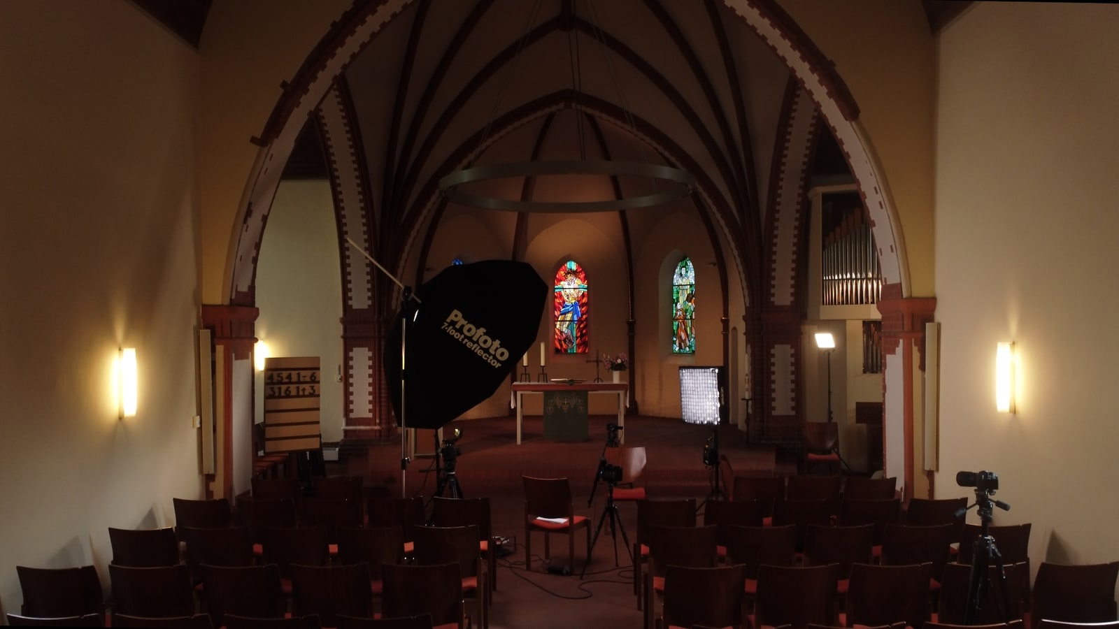 Interior view of the church with a controlled interview lighting setup.